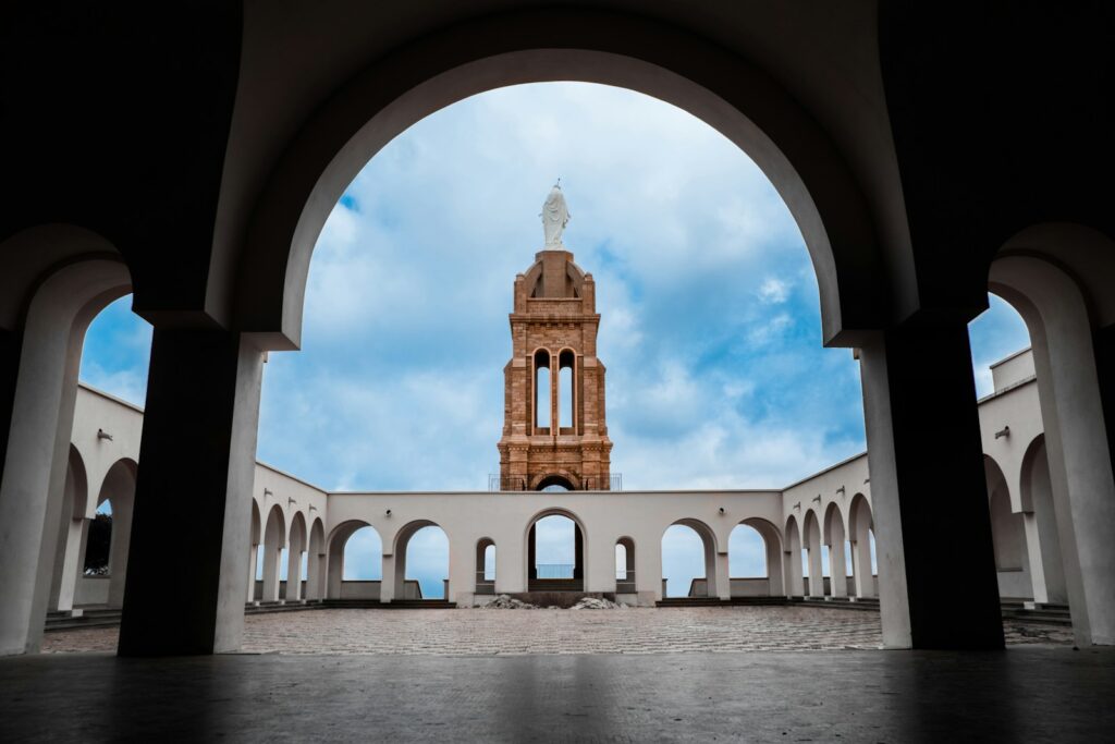 a large building with a statue in the middle
